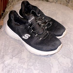 Pair of womens sketcher sport tennis shoes